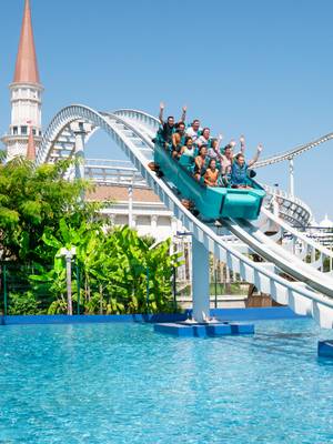 Guests enjoying an exciting water roller coaster ride at The Land of Legends Theme Park, Rixos Premium Belek, Infinia Vacation Club.